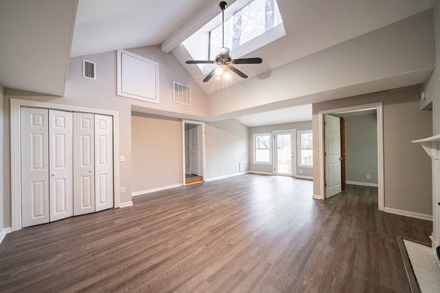 unfurnished living room featuring a skylight, high vaulted ceiling, dark hardwood / wood-style flooring, beamed ceiling, and ceiling fan