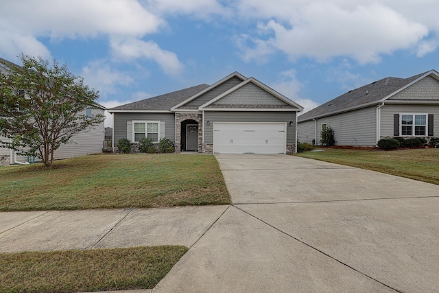 view of front of property featuring a front lawn and a garage