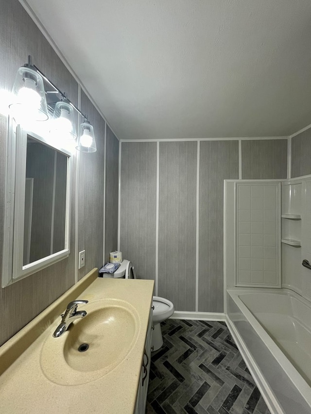 full bathroom with shower / bathing tub combination, vanity, and toilet