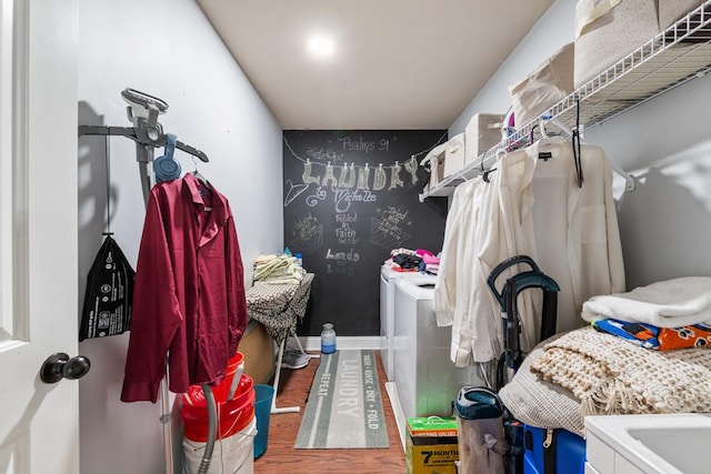 50 Riverside Lndg, Fort Mitchell, AL 36856 - walk in closet featuring separate washer and dryer and wood finished floors