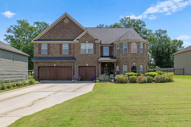 50 Riverside Lndg, Fort Mitchell, AL 36856 - view of front of home with an attached garage, brick siding, and driveway