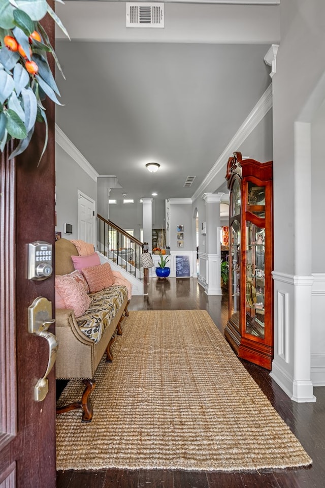 50 Riverside Lndg, Fort Mitchell, AL 36856 - entrance foyer featuring crown molding, stairway, wainscoting, wood finished floors, and a decorative wall