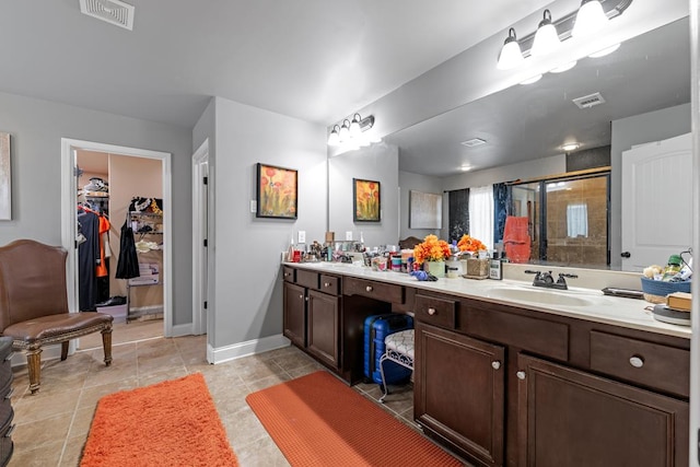 50 Riverside Lndg, Fort Mitchell, AL 36856 - full bath featuring a stall shower, double vanity, a walk in closet, and tile patterned floors