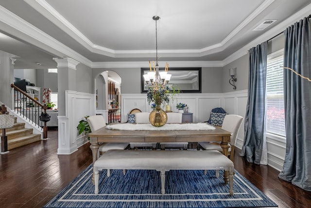 50 Riverside Lndg, Fort Mitchell, AL 36856 - dining space with a tray ceiling, arched walkways, a decorative wall, wood-type flooring, and plenty of natural light