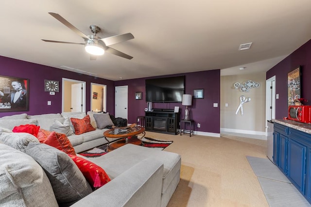 50 Riverside Lndg, Fort Mitchell, AL 36856 - living room featuring light colored carpet, ceiling fan, and a fireplace with flush hearth