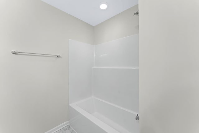 bathroom with recessed lighting and baseboards