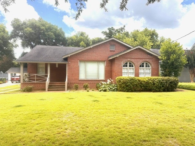 1616 Crest Dr, Columbus, GA 31906 - ranch-style home featuring covered porch, a front lawn, and brick siding