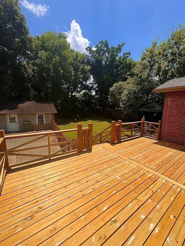 1616 Crest Dr, Columbus, GA 31906 - wooden terrace featuring an outdoor structure and view of scattered trees