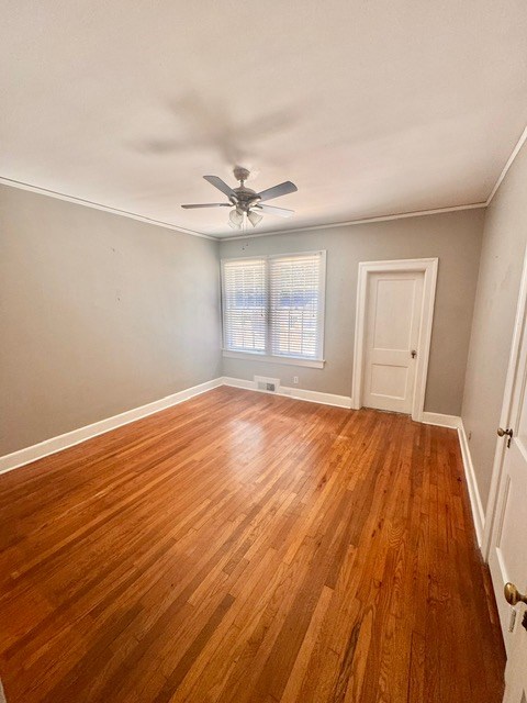 1616 Crest Dr, Columbus, GA 31906 - unfurnished room with light wood-type flooring, a ceiling fan, and ornamental molding