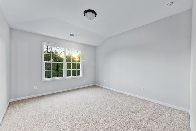 33 Oak Ridge Dr, Waverly Hall, GA 31831 - unfurnished room with carpet floors, vaulted ceiling, visible vents, and baseboards