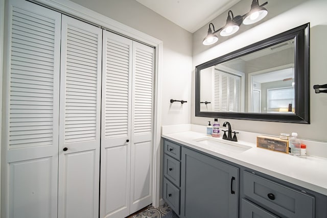 bathroom featuring a closet and vanity