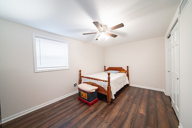 bedroom featuring visible vents, baseboards, and dark wood-type flooring