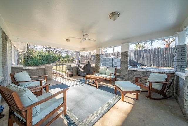 view of patio with a grill, an outdoor hangout area, a ceiling fan, and fence