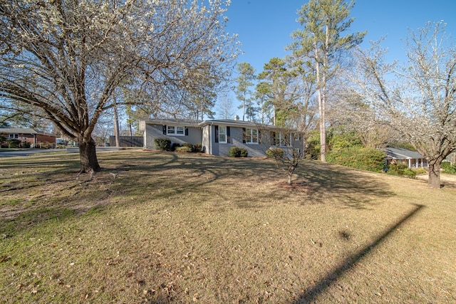 ranch-style house with a front yard