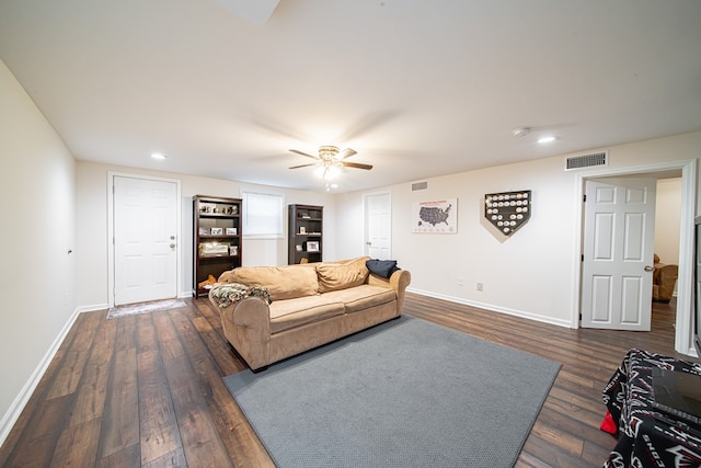 living area with recessed lighting, visible vents, baseboards, and dark wood finished floors