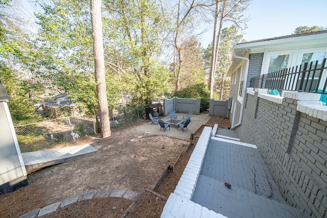 view of yard featuring a patio area and a fenced backyard