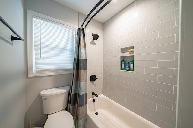 bathroom with plenty of natural light, toilet, and shower / bath combo