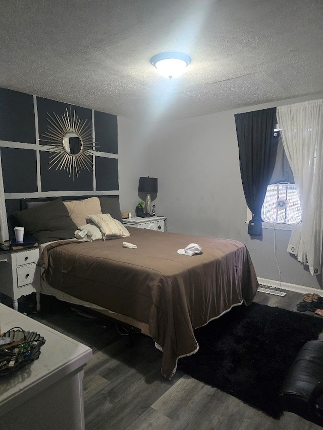 20 Patch Dr, Columbus, GA 31903 - bedroom with a textured ceiling and wood finished floors