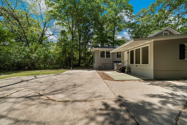 back of property featuring entry steps