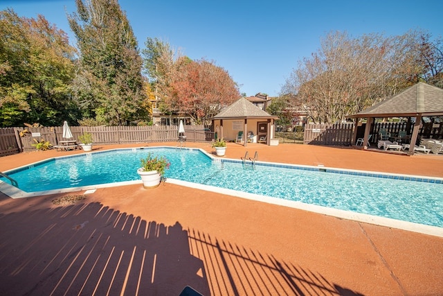 view of swimming pool with a gazebo and a patio area