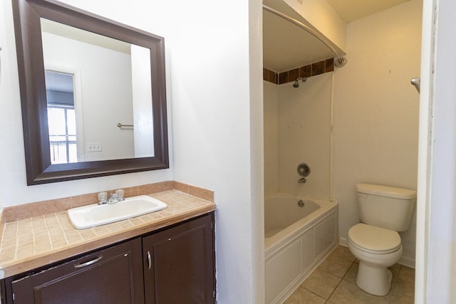 full bathroom featuring vanity, tile patterned flooring, toilet, and washtub / shower combination