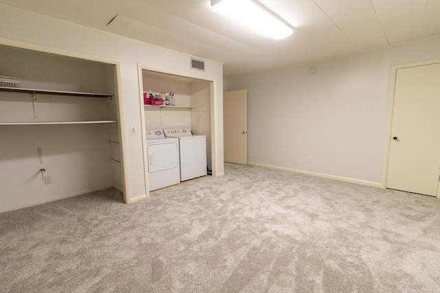 laundry area featuring washer and dryer and carpet floors