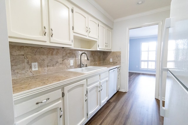 kitchen with sink, white dishwasher, tasteful backsplash, ornamental molding, and white cabinets