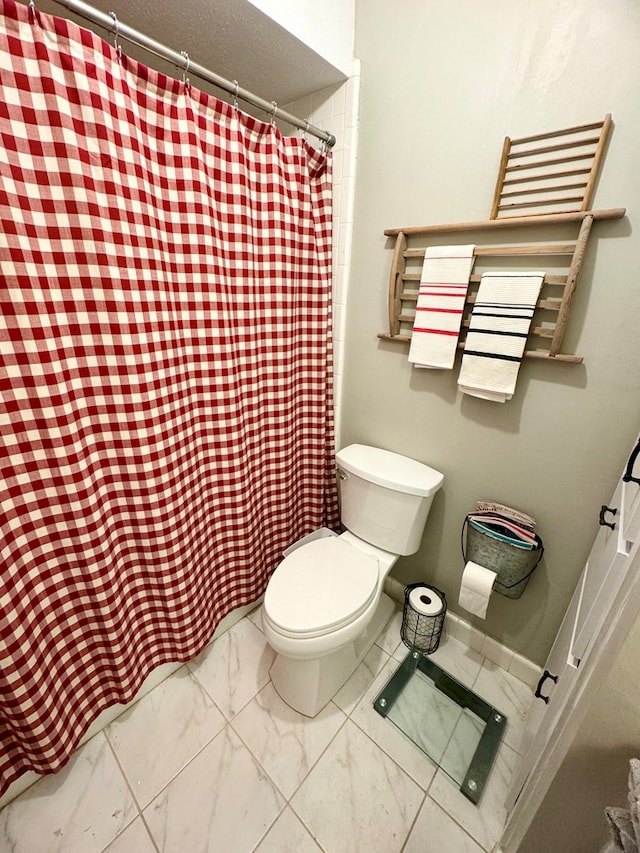 bathroom featuring toilet