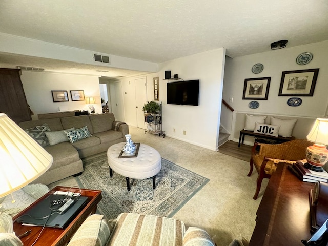 living room with carpet floors and a textured ceiling