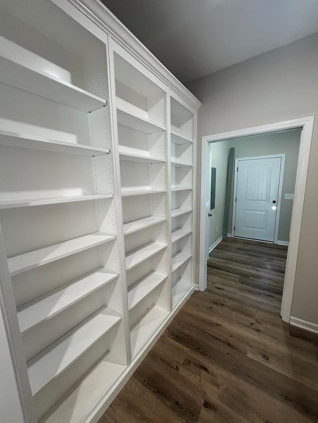 corridor with dark wood finished floors