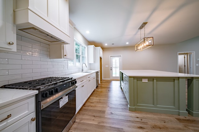 821 Lichfield Rd, Columbus, GA 31904 - kitchen featuring gas stove, dishwasher, custom exhaust hood, tasteful backsplash, and light wood-type flooring