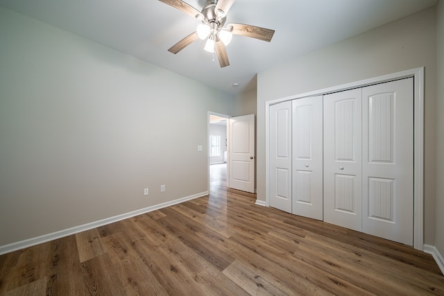 821 Lichfield Rd, Columbus, GA 31904 - unfurnished bedroom with wood finished floors, a closet, and ceiling fan