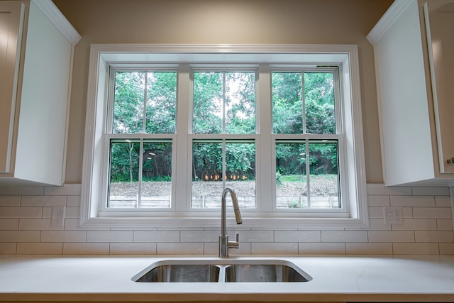 821 Lichfield Rd, Columbus, GA 31904 - kitchen with decorative backsplash and white cabinets