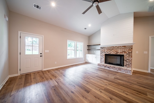 821 Lichfield Rd, Columbus, GA 31904 - unfurnished living room featuring wood finished floors, a ceiling fan, high vaulted ceiling, a fireplace, and recessed lighting