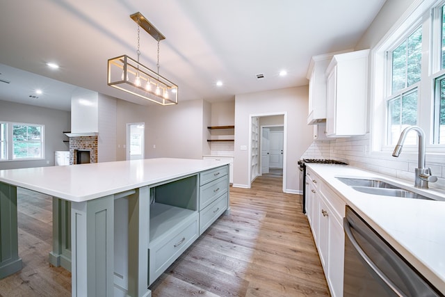 821 Lichfield Rd, Columbus, GA 31904 - kitchen with appliances with stainless steel finishes, open shelves, white cabinets, light countertops, and recessed lighting
