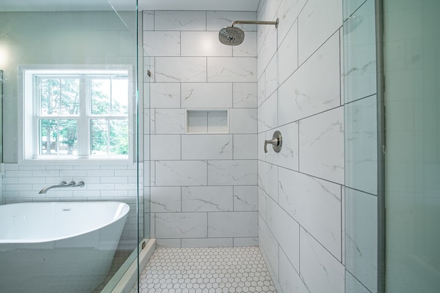 821 Lichfield Rd, Columbus, GA 31904 - full bath featuring a stall shower, a soaking tub, and tile walls