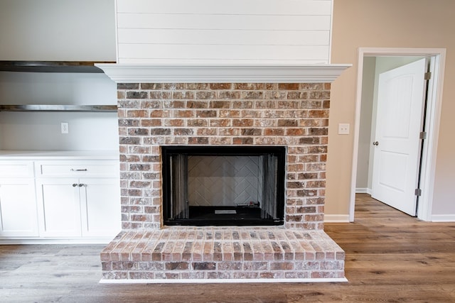 821 Lichfield Rd, Columbus, GA 31904 - detailed view of wood finished floors and a brick fireplace