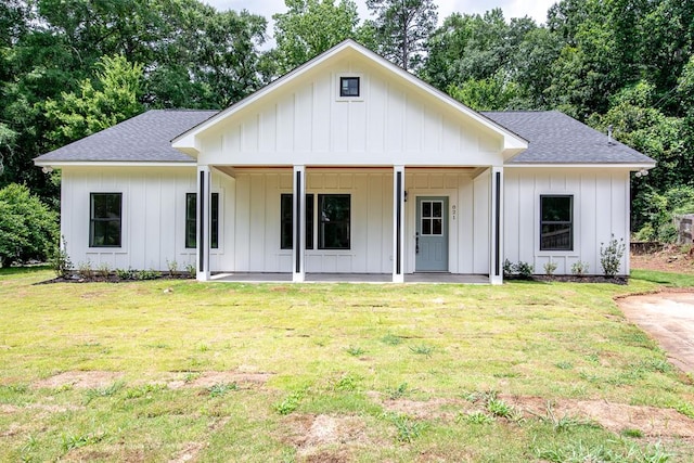 821 Lichfield Rd, Columbus, GA 31904 - modern inspired farmhouse with board and batten siding, a shingled roof, a front yard, and covered porch