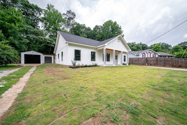 821 Lichfield Rd, Columbus, GA 31904 - modern farmhouse featuring a detached garage, board and batten siding, a porch, an outdoor structure, and driveway