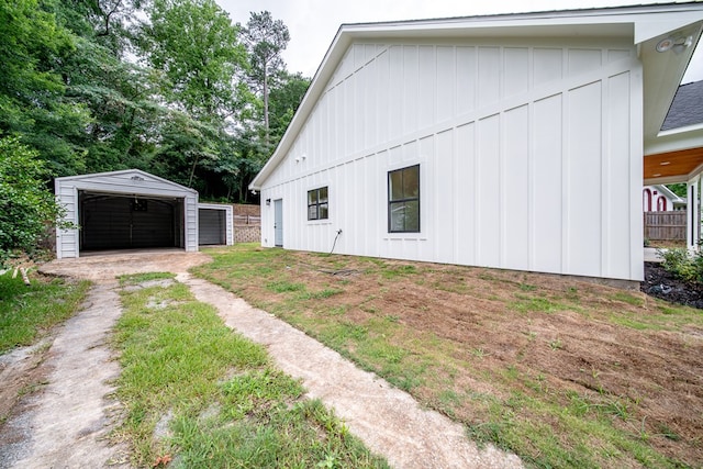 821 Lichfield Rd, Columbus, GA 31904 - view of home's exterior with board and batten siding, an outbuilding, and a garage