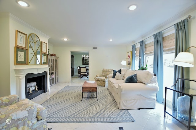 living area featuring an inviting chandelier, marble finish floor, ornamental molding, and recessed lighting