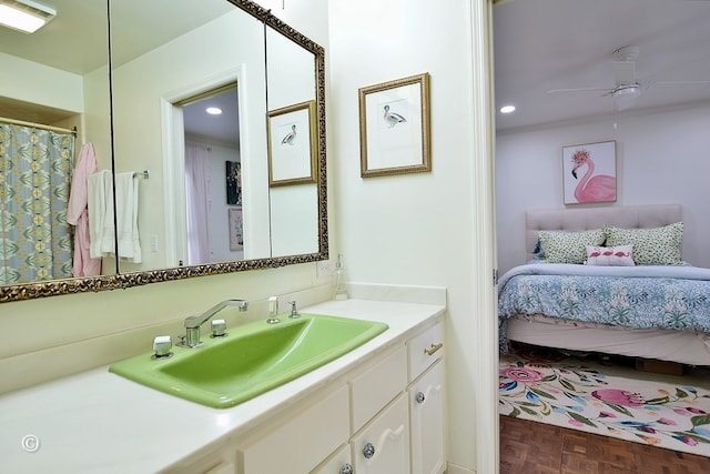 bathroom featuring a ceiling fan, ensuite bathroom, vanity, and recessed lighting