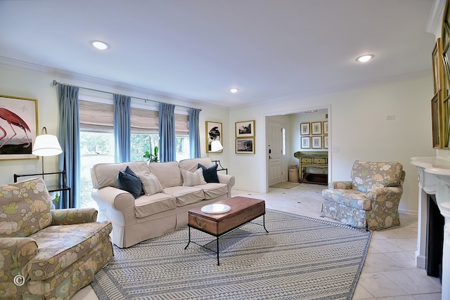 living area featuring a fireplace, ornamental molding, and recessed lighting