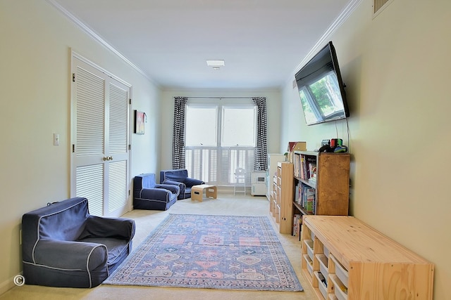 living area with ornamental molding, visible vents, and light colored carpet