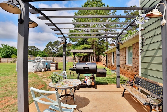 view of patio featuring a fenced backyard, grilling area, and a pergola