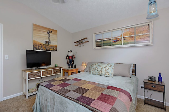 carpeted bedroom featuring baseboards and vaulted ceiling