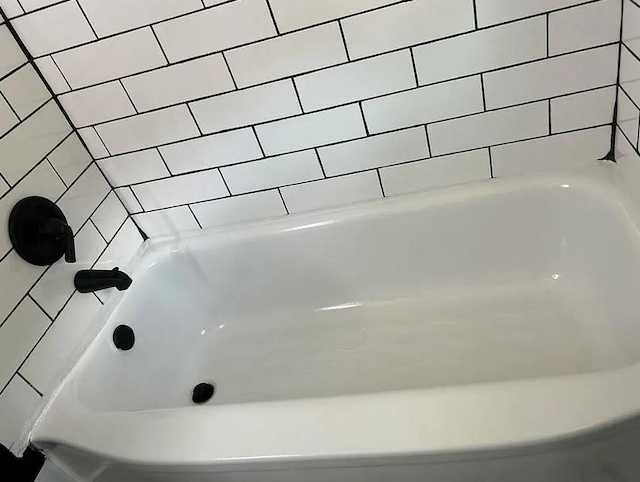 bathroom with a tub