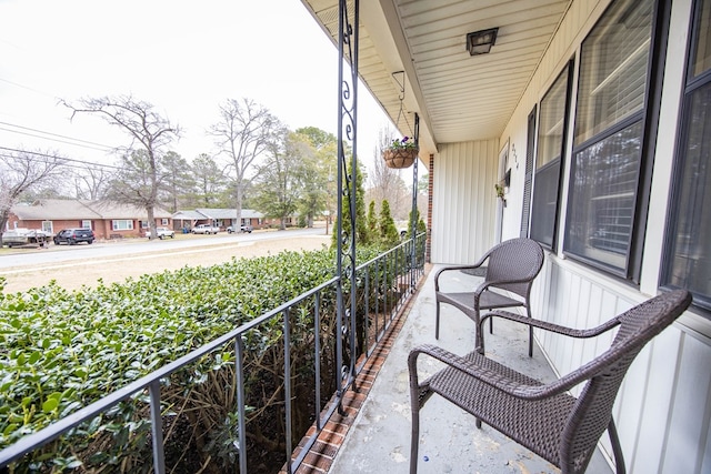 balcony featuring a porch and a residential view