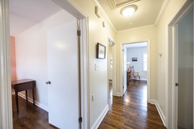 hallway with dark wood-style floors, baseboards, and ornamental molding