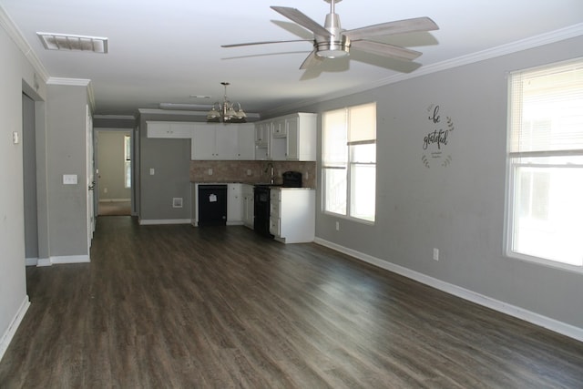 3813 Meritas Dr, Columbus, GA 31904 - unfurnished living room featuring ornamental molding, ceiling fan, dark wood-type flooring, and a chandelier